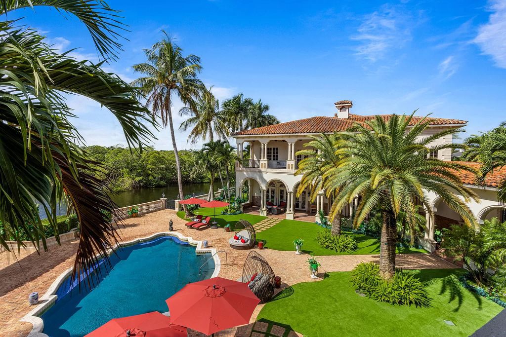 Nestled on a prime 1.06-acre waterfront estate at 5001 Egret Point Circle, Boca Raton, this Italianate marvel in The Sanctuary presents 8 bedrooms, 14 baths, and 14,848 square feet of opulent living space, meticulously crafted in 2005.