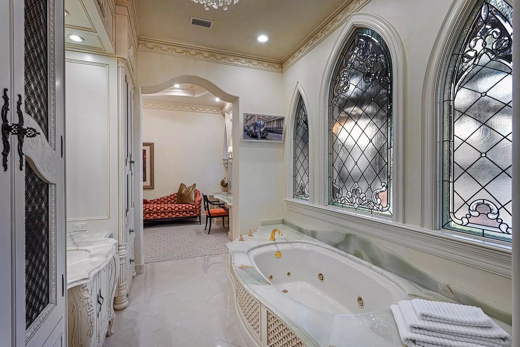 Nestled on a prime 1.06-acre waterfront estate at 5001 Egret Point Circle, Boca Raton, this Italianate marvel in The Sanctuary presents 8 bedrooms, 14 baths, and 14,848 square feet of opulent living space, meticulously crafted in 2005.