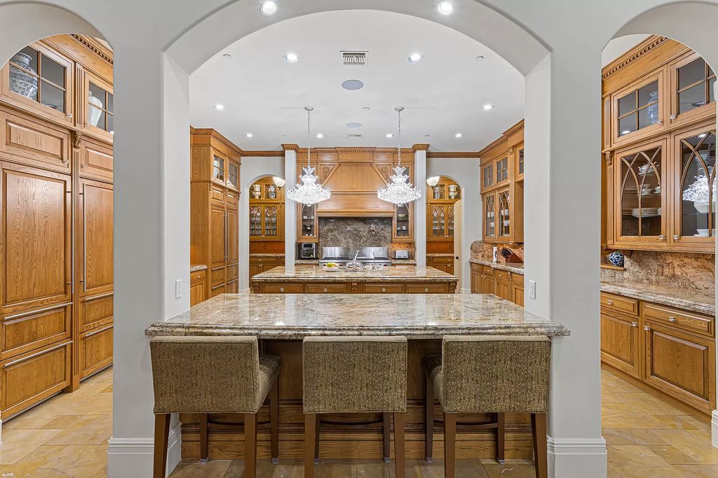 Nestled on a prime 1.06-acre waterfront estate at 5001 Egret Point Circle, Boca Raton, this Italianate marvel in The Sanctuary presents 8 bedrooms, 14 baths, and 14,848 square feet of opulent living space, meticulously crafted in 2005.