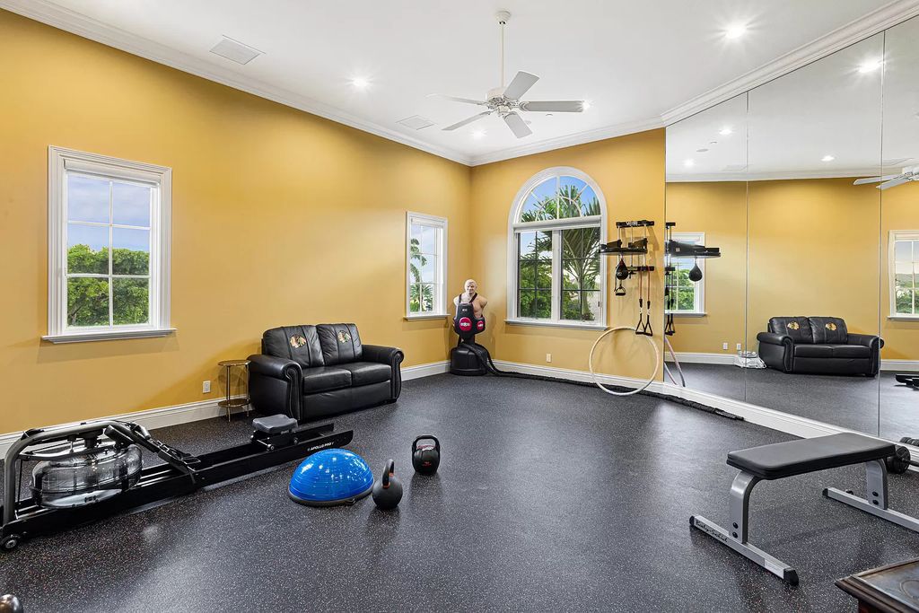 Nestled on a prime 1.06-acre waterfront estate at 5001 Egret Point Circle, Boca Raton, this Italianate marvel in The Sanctuary presents 8 bedrooms, 14 baths, and 14,848 square feet of opulent living space, meticulously crafted in 2005.