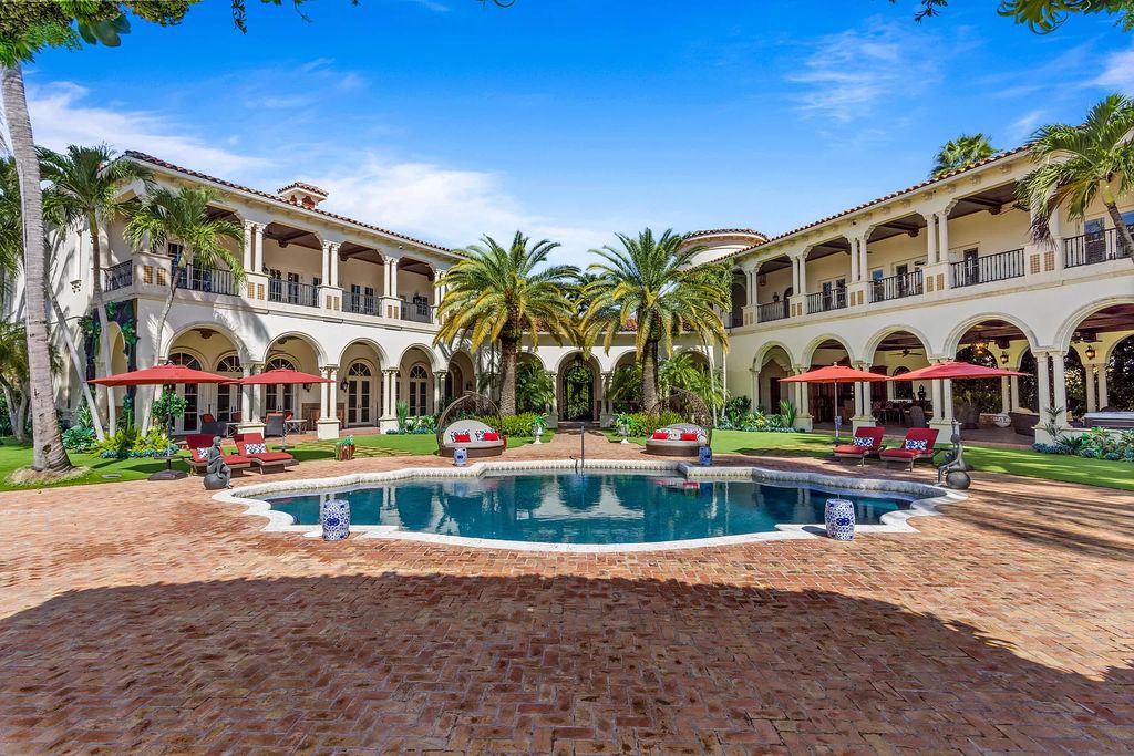 Nestled on a prime 1.06-acre waterfront estate at 5001 Egret Point Circle, Boca Raton, this Italianate marvel in The Sanctuary presents 8 bedrooms, 14 baths, and 14,848 square feet of opulent living space, meticulously crafted in 2005.