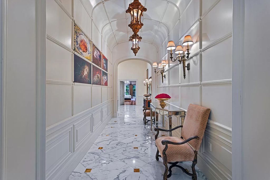 Nestled on a prime 1.06-acre waterfront estate at 5001 Egret Point Circle, Boca Raton, this Italianate marvel in The Sanctuary presents 8 bedrooms, 14 baths, and 14,848 square feet of opulent living space, meticulously crafted in 2005.