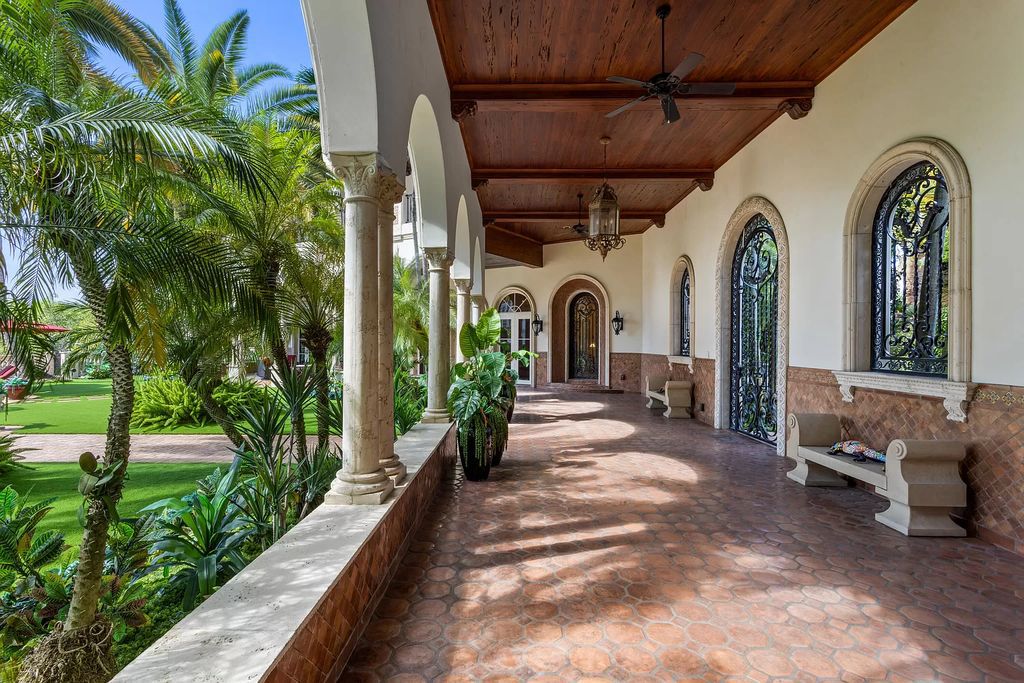 Nestled on a prime 1.06-acre waterfront estate at 5001 Egret Point Circle, Boca Raton, this Italianate marvel in The Sanctuary presents 8 bedrooms, 14 baths, and 14,848 square feet of opulent living space, meticulously crafted in 2005.