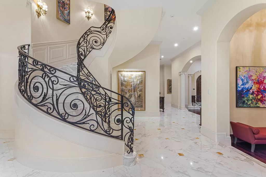 Nestled on a prime 1.06-acre waterfront estate at 5001 Egret Point Circle, Boca Raton, this Italianate marvel in The Sanctuary presents 8 bedrooms, 14 baths, and 14,848 square feet of opulent living space, meticulously crafted in 2005.