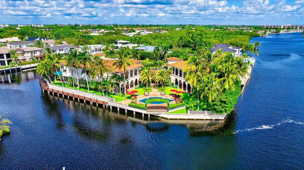 Nestled on a prime 1.06-acre waterfront estate at 5001 Egret Point Circle, Boca Raton, this Italianate marvel in The Sanctuary presents 8 bedrooms, 14 baths, and 14,848 square feet of opulent living space, meticulously crafted in 2005.
