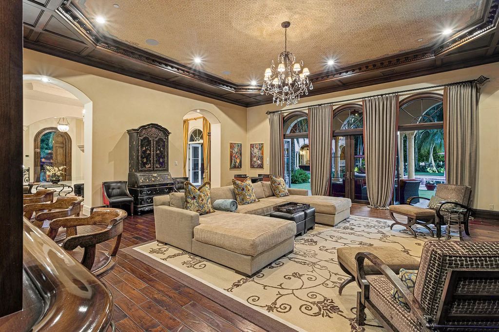 Nestled on a prime 1.06-acre waterfront estate at 5001 Egret Point Circle, Boca Raton, this Italianate marvel in The Sanctuary presents 8 bedrooms, 14 baths, and 14,848 square feet of opulent living space, meticulously crafted in 2005.