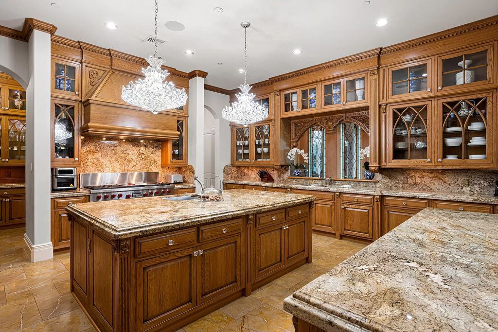 Nestled on a prime 1.06-acre waterfront estate at 5001 Egret Point Circle, Boca Raton, this Italianate marvel in The Sanctuary presents 8 bedrooms, 14 baths, and 14,848 square feet of opulent living space, meticulously crafted in 2005.