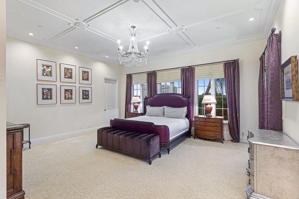 Nestled on a prime 1.06-acre waterfront estate at 5001 Egret Point Circle, Boca Raton, this Italianate marvel in The Sanctuary presents 8 bedrooms, 14 baths, and 14,848 square feet of opulent living space, meticulously crafted in 2005.