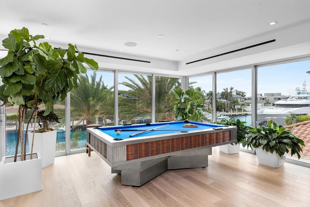 Discover The Isla Bahia Estate, an architectural marvel in Fort Lauderdale's Harbour Beach. With 6 bedrooms, 11 baths, and over 10,800 square feet, this 2018-built waterfront mansion offers unparalleled luxury, boasting a gourmet kitchen, a theater, and an elevator.
