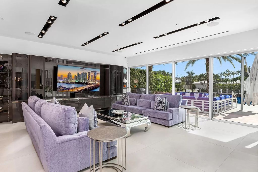 Discover The Isla Bahia Estate, an architectural marvel in Fort Lauderdale's Harbour Beach. With 6 bedrooms, 11 baths, and over 10,800 square feet, this 2018-built waterfront mansion offers unparalleled luxury, boasting a gourmet kitchen, a theater, and an elevator.