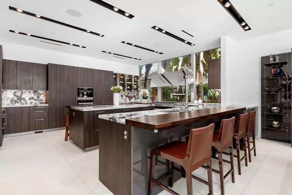 Discover The Isla Bahia Estate, an architectural marvel in Fort Lauderdale's Harbour Beach. With 6 bedrooms, 11 baths, and over 10,800 square feet, this 2018-built waterfront mansion offers unparalleled luxury, boasting a gourmet kitchen, a theater, and an elevator.