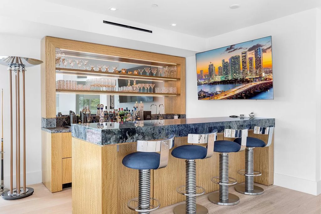 Discover The Isla Bahia Estate, an architectural marvel in Fort Lauderdale's Harbour Beach. With 6 bedrooms, 11 baths, and over 10,800 square feet, this 2018-built waterfront mansion offers unparalleled luxury, boasting a gourmet kitchen, a theater, and an elevator.