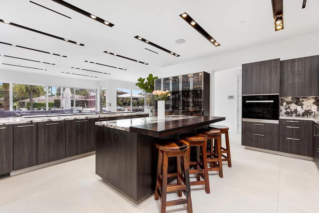 Discover The Isla Bahia Estate, an architectural marvel in Fort Lauderdale's Harbour Beach. With 6 bedrooms, 11 baths, and over 10,800 square feet, this 2018-built waterfront mansion offers unparalleled luxury, boasting a gourmet kitchen, a theater, and an elevator.