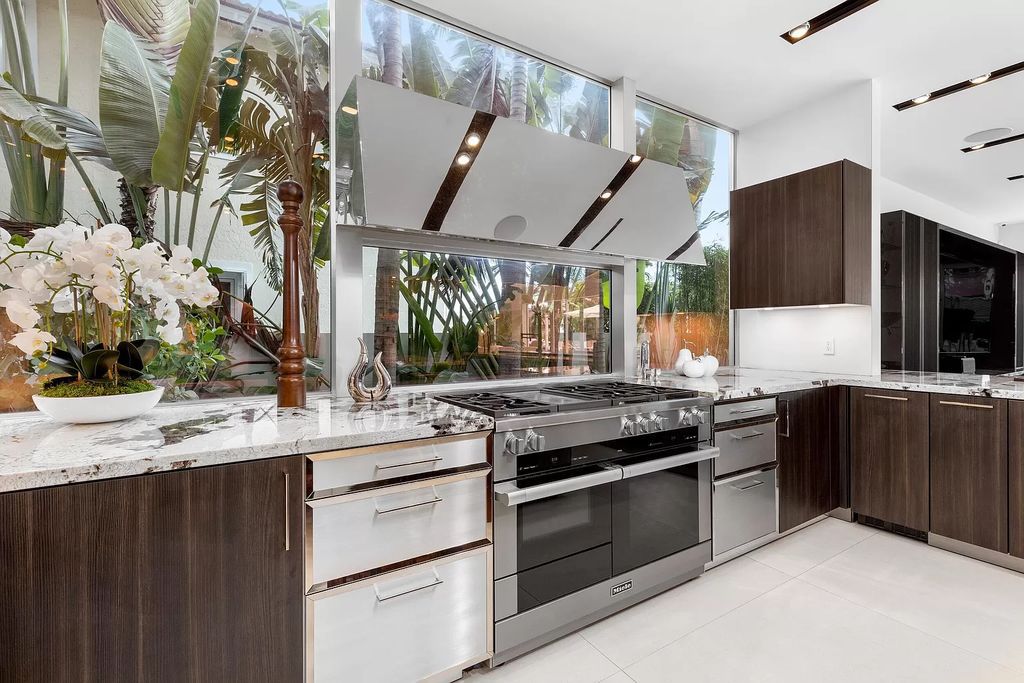 Discover The Isla Bahia Estate, an architectural marvel in Fort Lauderdale's Harbour Beach. With 6 bedrooms, 11 baths, and over 10,800 square feet, this 2018-built waterfront mansion offers unparalleled luxury, boasting a gourmet kitchen, a theater, and an elevator.