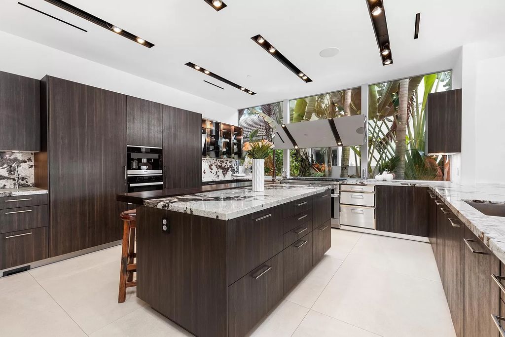 Discover The Isla Bahia Estate, an architectural marvel in Fort Lauderdale's Harbour Beach. With 6 bedrooms, 11 baths, and over 10,800 square feet, this 2018-built waterfront mansion offers unparalleled luxury, boasting a gourmet kitchen, a theater, and an elevator.