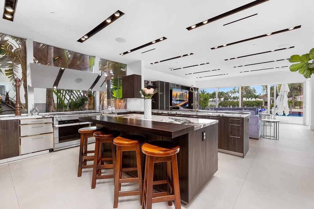 Discover The Isla Bahia Estate, an architectural marvel in Fort Lauderdale's Harbour Beach. With 6 bedrooms, 11 baths, and over 10,800 square feet, this 2018-built waterfront mansion offers unparalleled luxury, boasting a gourmet kitchen, a theater, and an elevator.