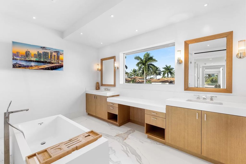 Discover The Isla Bahia Estate, an architectural marvel in Fort Lauderdale's Harbour Beach. With 6 bedrooms, 11 baths, and over 10,800 square feet, this 2018-built waterfront mansion offers unparalleled luxury, boasting a gourmet kitchen, a theater, and an elevator.