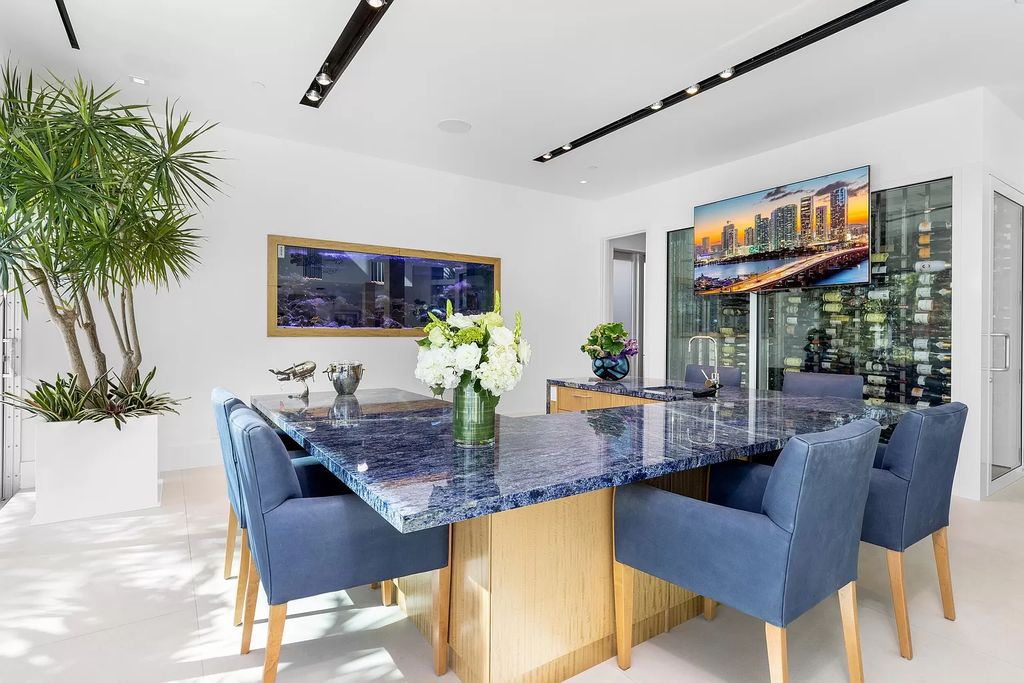 Discover The Isla Bahia Estate, an architectural marvel in Fort Lauderdale's Harbour Beach. With 6 bedrooms, 11 baths, and over 10,800 square feet, this 2018-built waterfront mansion offers unparalleled luxury, boasting a gourmet kitchen, a theater, and an elevator.