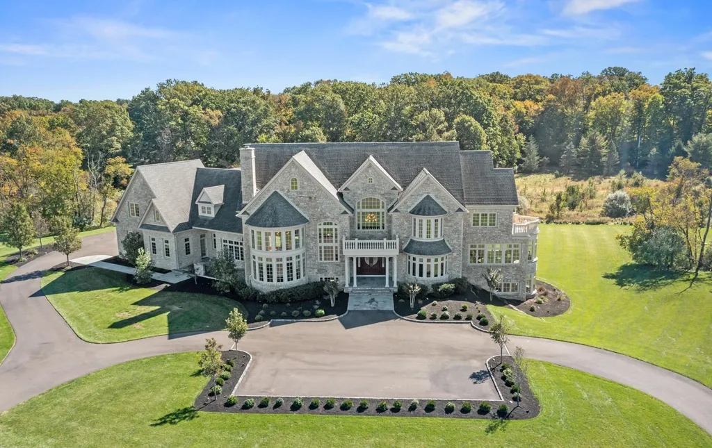 10 Stonebridge Crossing Road Home in Newtown, Pennsylvania. Immerse yourself in the epitome of luxury living with this meticulously crafted 10,000+ sq ft estate by Zavetta Custom Homes. Nestled in Historic Washington Crossing, this exclusive property on Stonebridge Crossing Road offers unparalleled quality, commanding views, and the rare opportunity to enjoy a life of opulence in Bucks County.