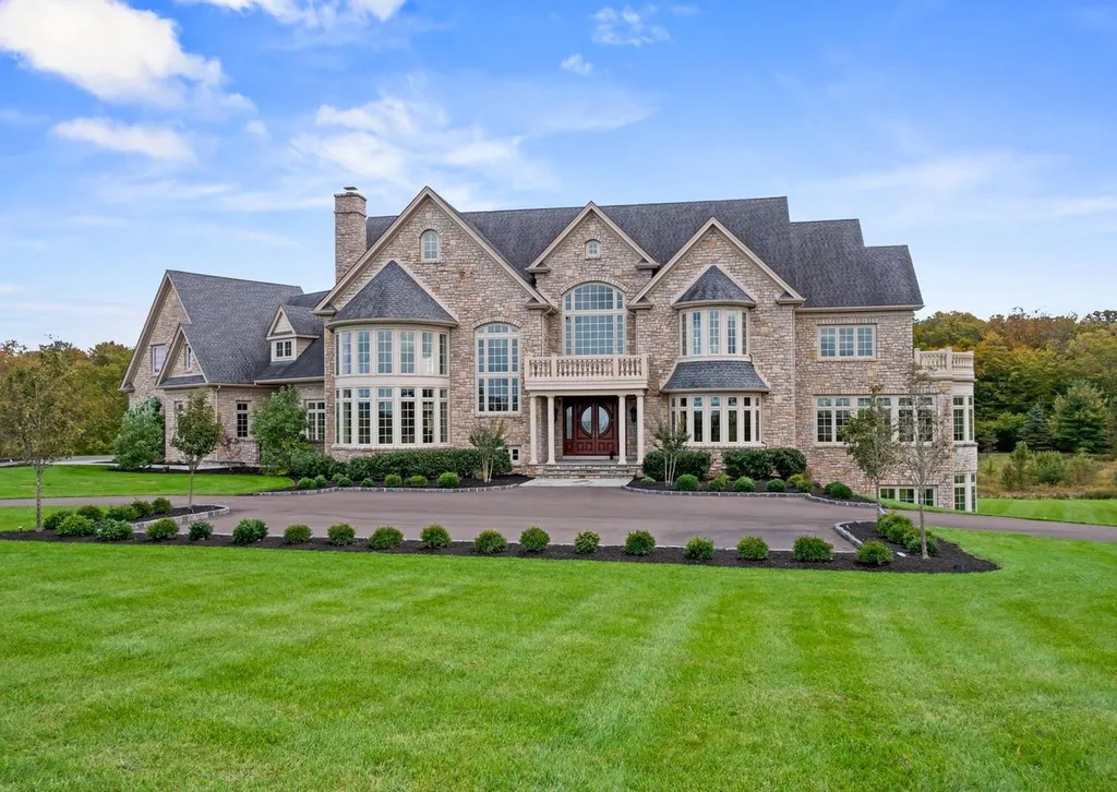 10 Stonebridge Crossing Road Home in Newtown, Pennsylvania. Immerse yourself in the epitome of luxury living with this meticulously crafted 10,000+ sq ft estate by Zavetta Custom Homes. Nestled in Historic Washington Crossing, this exclusive property on Stonebridge Crossing Road offers unparalleled quality, commanding views, and the rare opportunity to enjoy a life of opulence in Bucks County.