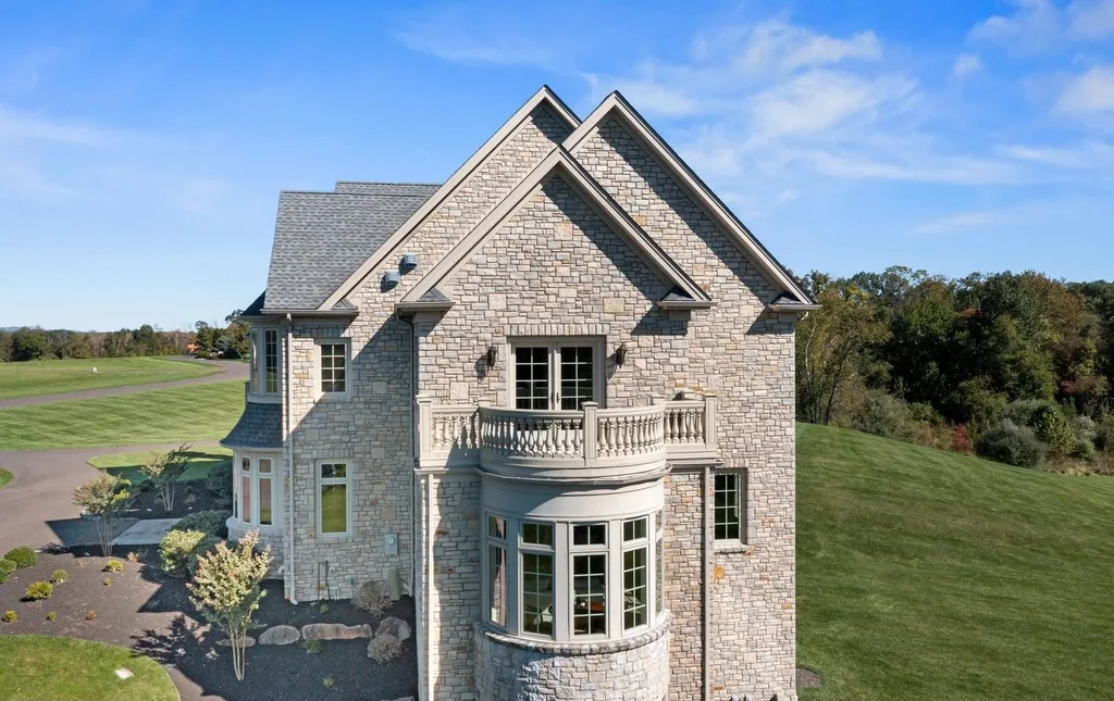 10 Stonebridge Crossing Road Home in Newtown, Pennsylvania. Immerse yourself in the epitome of luxury living with this meticulously crafted 10,000+ sq ft estate by Zavetta Custom Homes. Nestled in Historic Washington Crossing, this exclusive property on Stonebridge Crossing Road offers unparalleled quality, commanding views, and the rare opportunity to enjoy a life of opulence in Bucks County.