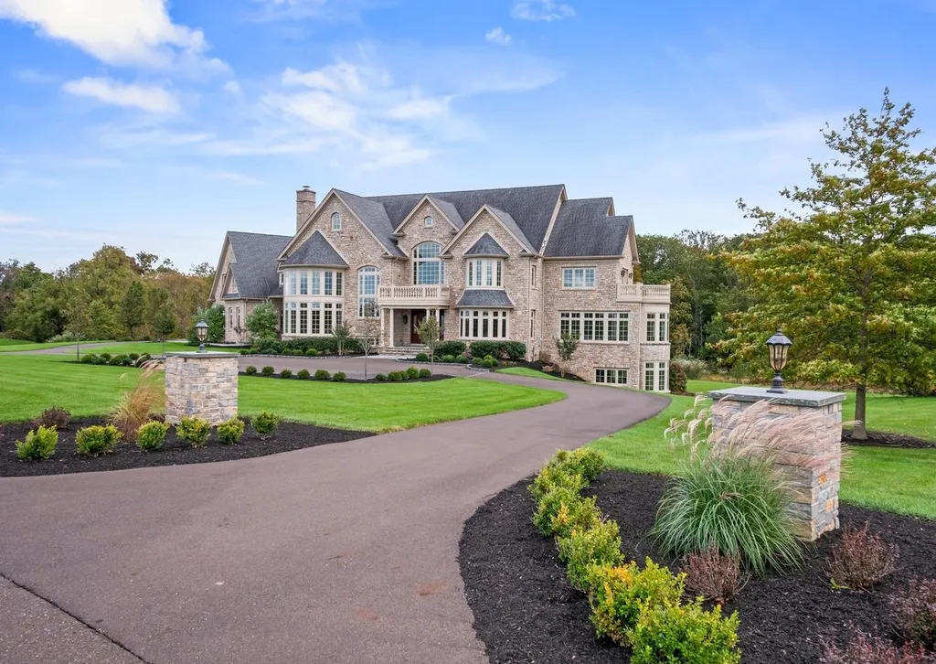 10 Stonebridge Crossing Road Home in Newtown, Pennsylvania. Immerse yourself in the epitome of luxury living with this meticulously crafted 10,000+ sq ft estate by Zavetta Custom Homes. Nestled in Historic Washington Crossing, this exclusive property on Stonebridge Crossing Road offers unparalleled quality, commanding views, and the rare opportunity to enjoy a life of opulence in Bucks County.