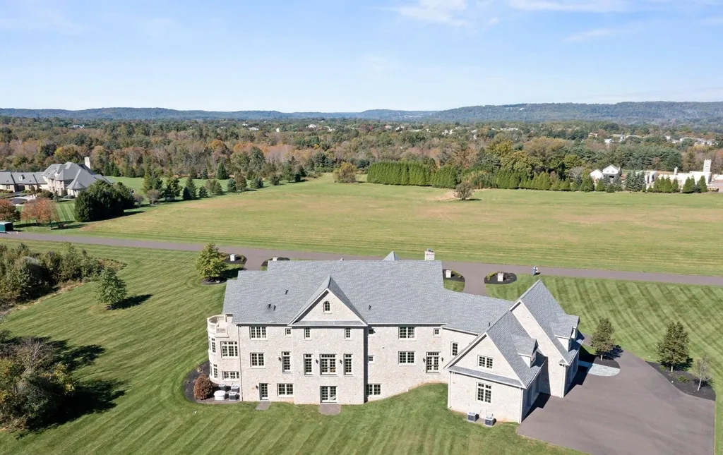 10 Stonebridge Crossing Road Home in Newtown, Pennsylvania. Immerse yourself in the epitome of luxury living with this meticulously crafted 10,000+ sq ft estate by Zavetta Custom Homes. Nestled in Historic Washington Crossing, this exclusive property on Stonebridge Crossing Road offers unparalleled quality, commanding views, and the rare opportunity to enjoy a life of opulence in Bucks County.