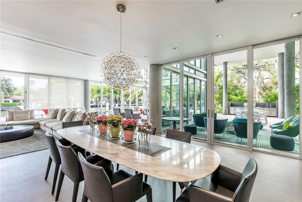 Discover an exquisite waterfront masterpiece along Fort Lauderdale's prestigious Rio Vista Boulevard. This modern marvel boasts 120 feet of New River frontage on a sprawling estate, where panoramic river views and lush tropical gardens merge seamlessly.