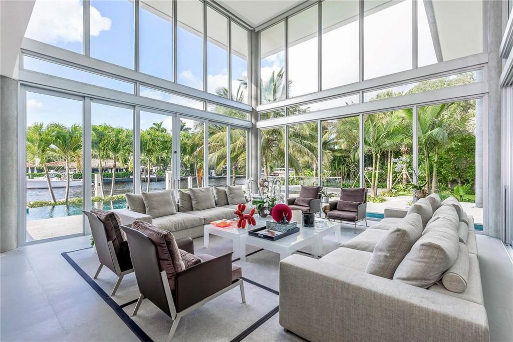 Discover an exquisite waterfront masterpiece along Fort Lauderdale's prestigious Rio Vista Boulevard. This modern marvel boasts 120 feet of New River frontage on a sprawling estate, where panoramic river views and lush tropical gardens merge seamlessly.