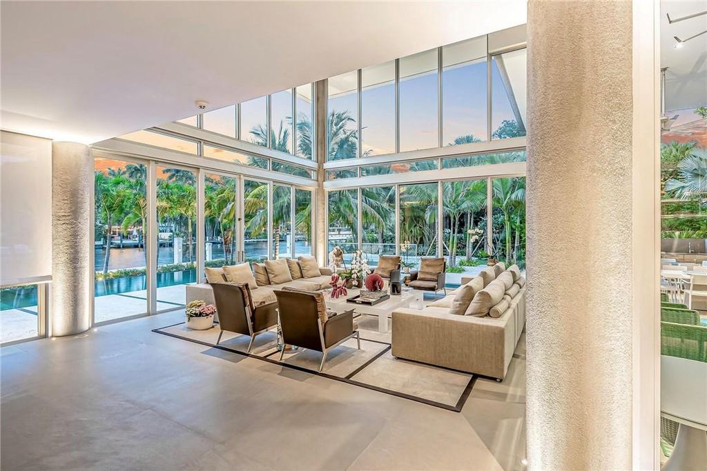 Discover an exquisite waterfront masterpiece along Fort Lauderdale's prestigious Rio Vista Boulevard. This modern marvel boasts 120 feet of New River frontage on a sprawling estate, where panoramic river views and lush tropical gardens merge seamlessly.