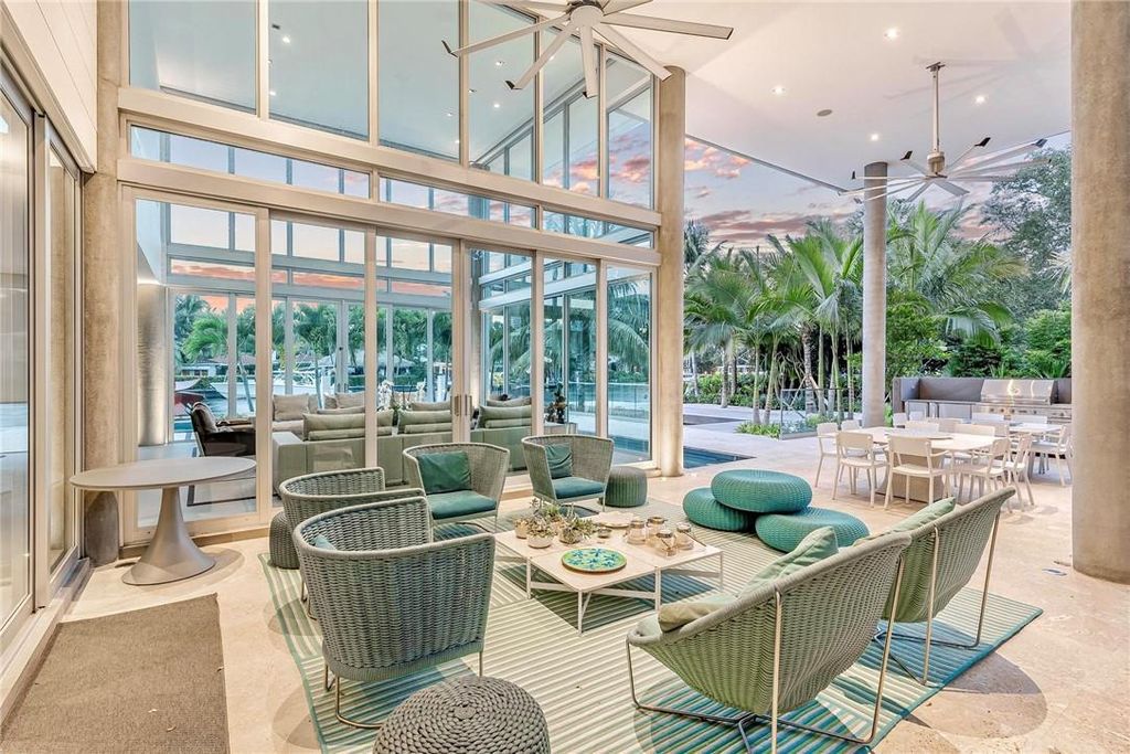 Discover an exquisite waterfront masterpiece along Fort Lauderdale's prestigious Rio Vista Boulevard. This modern marvel boasts 120 feet of New River frontage on a sprawling estate, where panoramic river views and lush tropical gardens merge seamlessly.