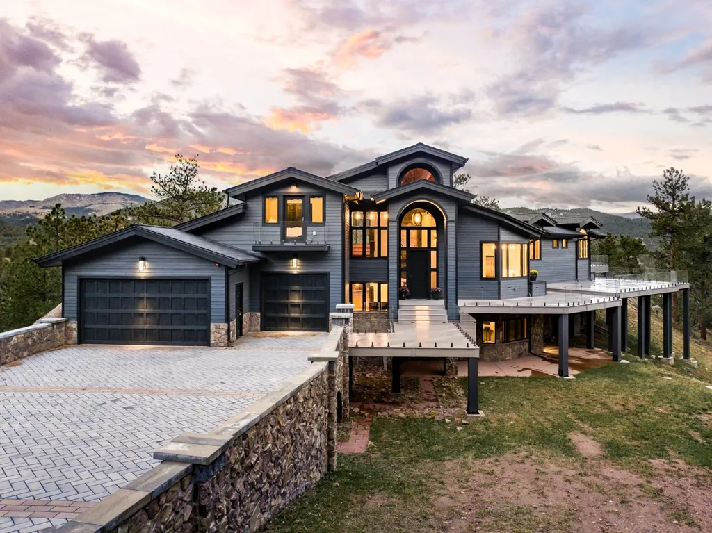 155 Wildwood Lane Home in Boulder, Colorado. Discover tranquility and luxury in this Pine Brook Hills home featuring stunning views of the Continental Divide. With an open floorplan, contemporary finishes, and spacious outdoor decks, this Boulder retreat offers a perfect blend of modern living and natural beauty.