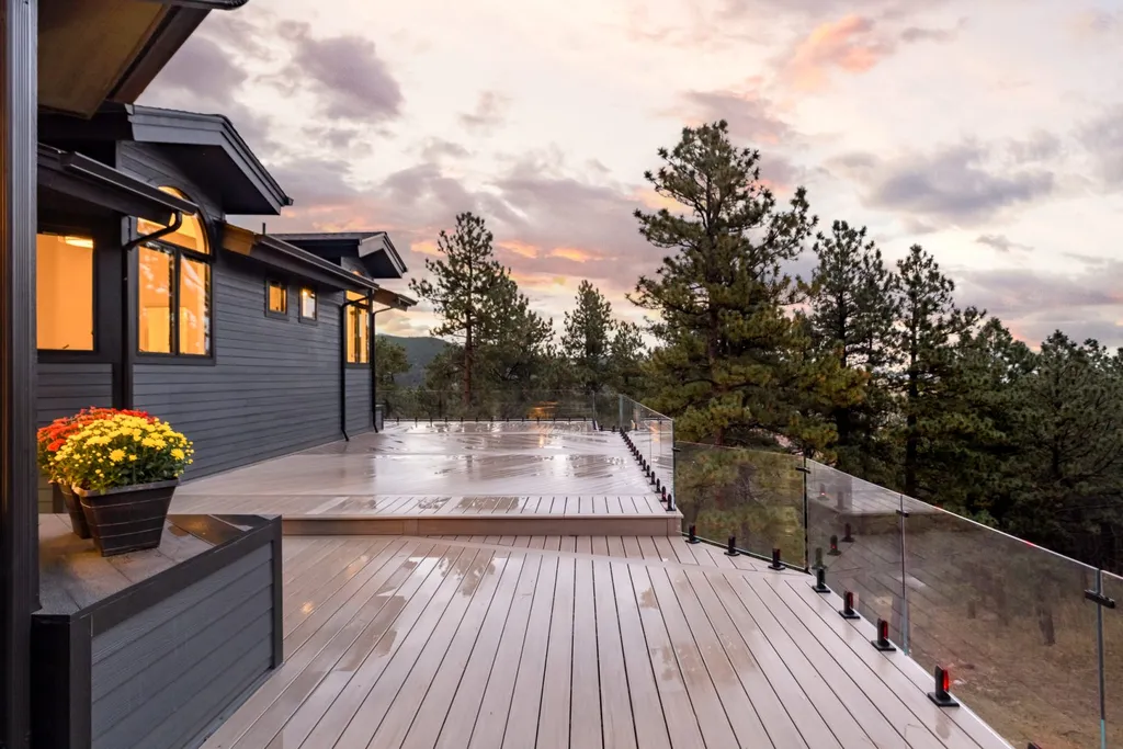 155 Wildwood Lane Home in Boulder, Colorado. Discover tranquility and luxury in this Pine Brook Hills home featuring stunning views of the Continental Divide. With an open floorplan, contemporary finishes, and spacious outdoor decks, this Boulder retreat offers a perfect blend of modern living and natural beauty.