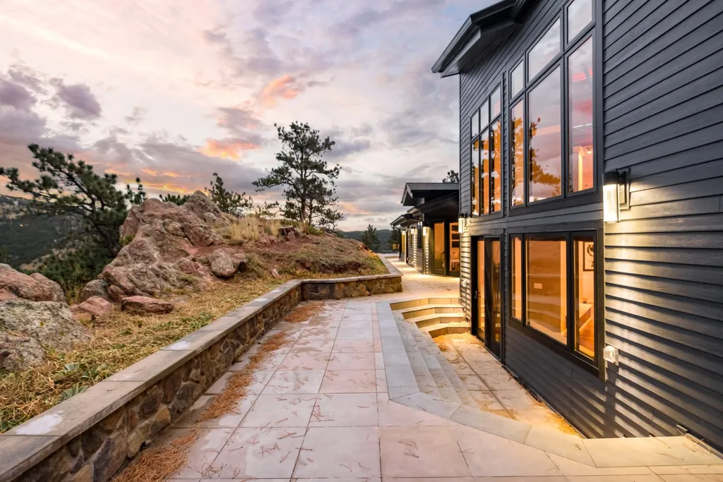 155 Wildwood Lane Home in Boulder, Colorado. Discover tranquility and luxury in this Pine Brook Hills home featuring stunning views of the Continental Divide. With an open floorplan, contemporary finishes, and spacious outdoor decks, this Boulder retreat offers a perfect blend of modern living and natural beauty.