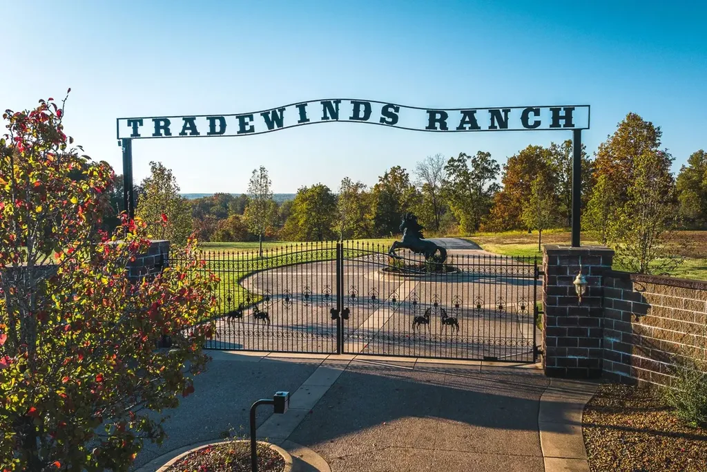 1812 Highway 42 Home in Brumley, Missouri. Discover the enchanting Tradewinds Ranch, a sprawling retreat nestled in Brumley, Missouri, offering a peaceful escape just two hours from both St. Louis and Kansas City. Spanning 1,065 acres, this meticulously crafted Ranch Compound reflects a profound understanding of the land, showcasing premium ranch and equestrian facilities, complemented by multiple residences, including the grand 13,000 sq.ft. main residence.