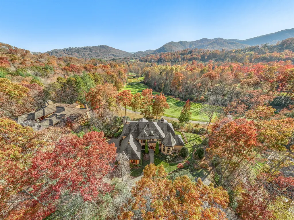 1987 White Tree Trail Home in Arden, North Carolina. Step into luxury living at this exceptional estate home overlooking the signature golf hole at The Cliffs of Walnut Cove. With old-world charm, meticulous details, and stunning mountain views, this residence offers a perfect blend of elegance and golf course living. Indulge in a gourmet kitchen, unique dining experiences, and a serene primary suite.