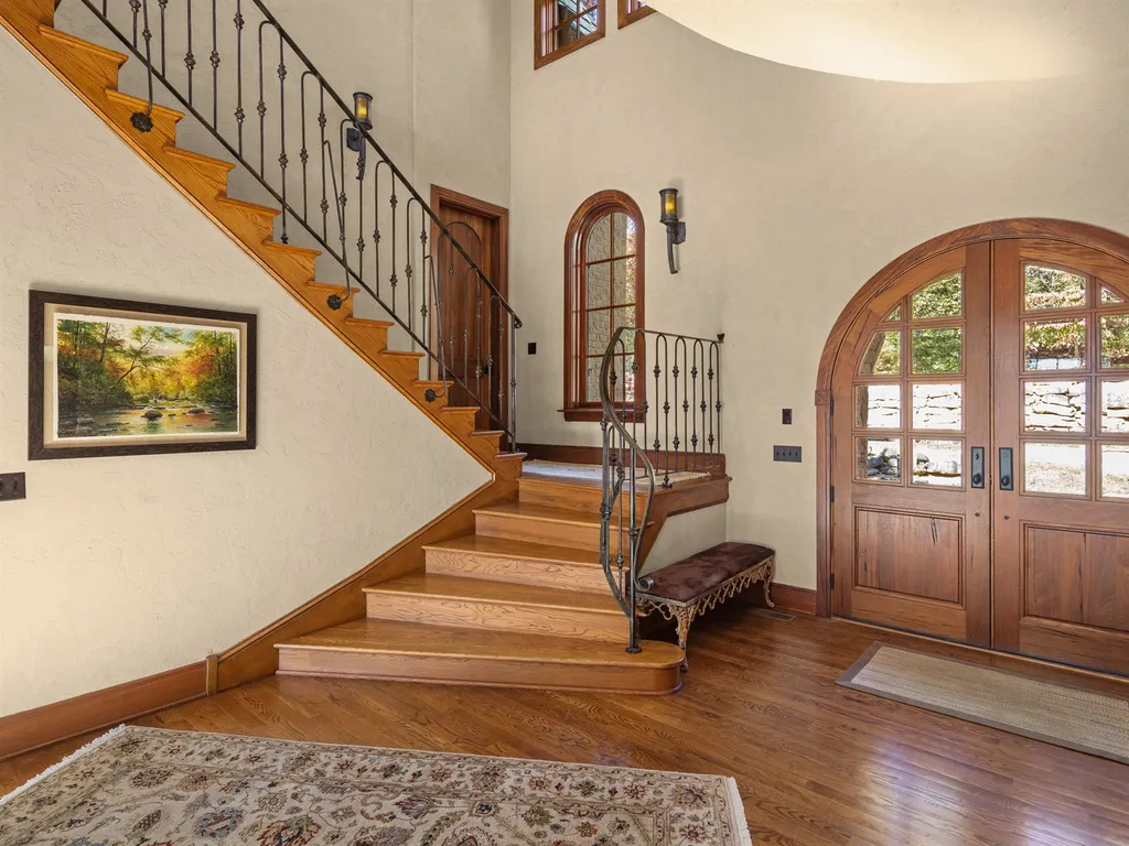 1987 White Tree Trail Home in Arden, North Carolina. Step into luxury living at this exceptional estate home overlooking the signature golf hole at The Cliffs of Walnut Cove. With old-world charm, meticulous details, and stunning mountain views, this residence offers a perfect blend of elegance and golf course living. Indulge in a gourmet kitchen, unique dining experiences, and a serene primary suite.