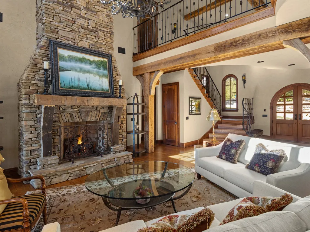 1987 White Tree Trail Home in Arden, North Carolina. Step into luxury living at this exceptional estate home overlooking the signature golf hole at The Cliffs of Walnut Cove. With old-world charm, meticulous details, and stunning mountain views, this residence offers a perfect blend of elegance and golf course living. Indulge in a gourmet kitchen, unique dining experiences, and a serene primary suite.