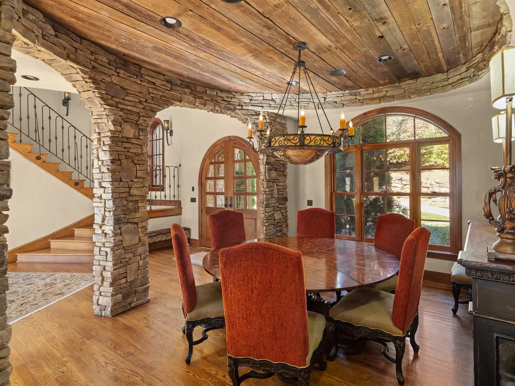 1987 White Tree Trail Home in Arden, North Carolina. Step into luxury living at this exceptional estate home overlooking the signature golf hole at The Cliffs of Walnut Cove. With old-world charm, meticulous details, and stunning mountain views, this residence offers a perfect blend of elegance and golf course living. Indulge in a gourmet kitchen, unique dining experiences, and a serene primary suite.