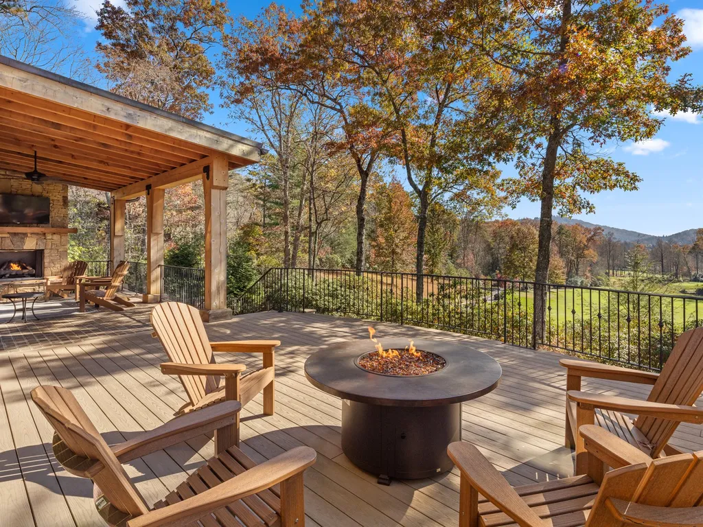 1987 White Tree Trail Home in Arden, North Carolina. Step into luxury living at this exceptional estate home overlooking the signature golf hole at The Cliffs of Walnut Cove. With old-world charm, meticulous details, and stunning mountain views, this residence offers a perfect blend of elegance and golf course living. Indulge in a gourmet kitchen, unique dining experiences, and a serene primary suite.