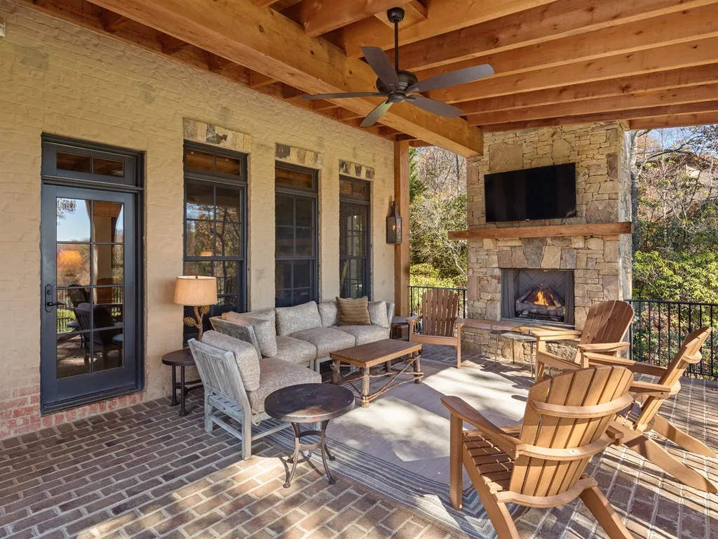 1987 White Tree Trail Home in Arden, North Carolina. Step into luxury living at this exceptional estate home overlooking the signature golf hole at The Cliffs of Walnut Cove. With old-world charm, meticulous details, and stunning mountain views, this residence offers a perfect blend of elegance and golf course living. Indulge in a gourmet kitchen, unique dining experiences, and a serene primary suite.