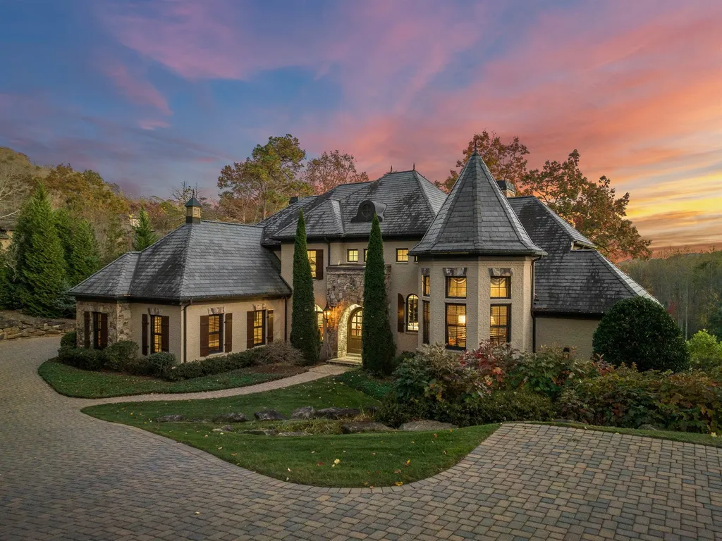 1987 White Tree Trail Home in Arden, North Carolina. Step into luxury living at this exceptional estate home overlooking the signature golf hole at The Cliffs of Walnut Cove. With old-world charm, meticulous details, and stunning mountain views, this residence offers a perfect blend of elegance and golf course living. Indulge in a gourmet kitchen, unique dining experiences, and a serene primary suite.