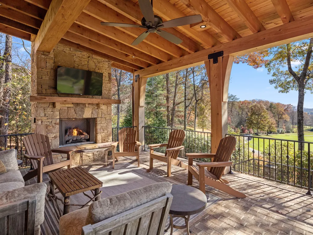 1987 White Tree Trail Home in Arden, North Carolina. Step into luxury living at this exceptional estate home overlooking the signature golf hole at The Cliffs of Walnut Cove. With old-world charm, meticulous details, and stunning mountain views, this residence offers a perfect blend of elegance and golf course living. Indulge in a gourmet kitchen, unique dining experiences, and a serene primary suite.
