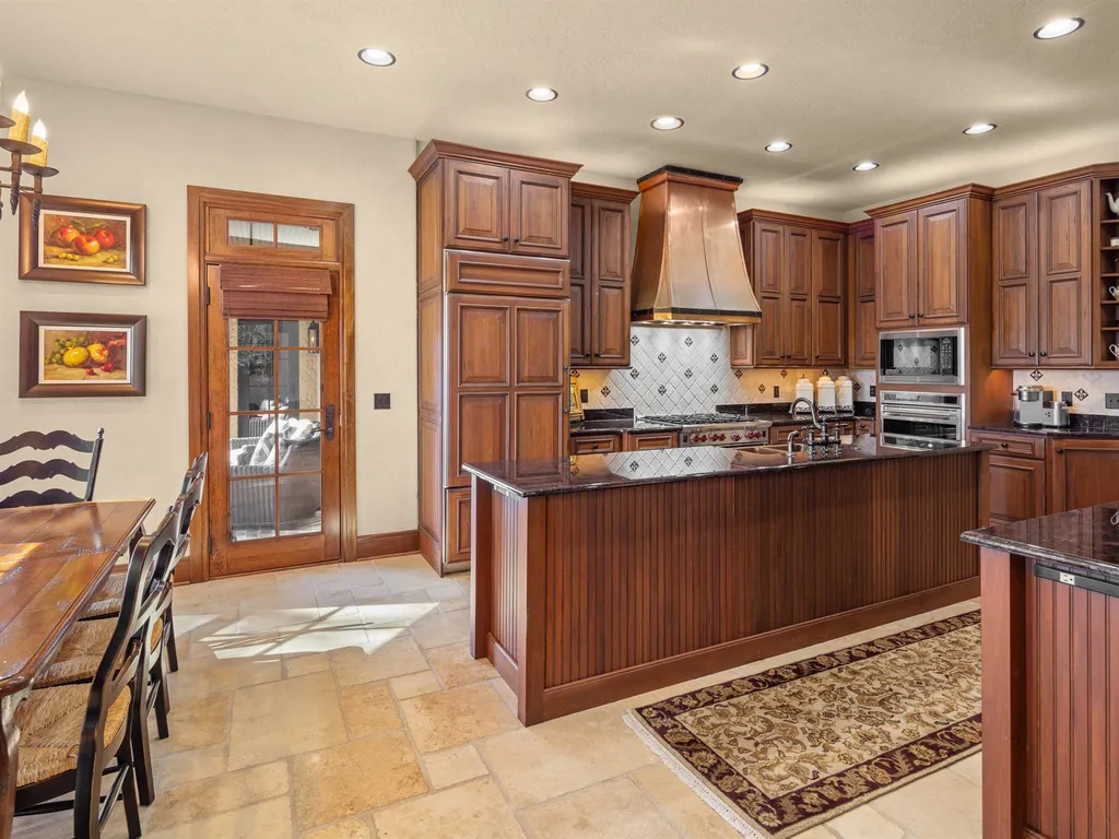 1987 White Tree Trail Home in Arden, North Carolina. Step into luxury living at this exceptional estate home overlooking the signature golf hole at The Cliffs of Walnut Cove. With old-world charm, meticulous details, and stunning mountain views, this residence offers a perfect blend of elegance and golf course living. Indulge in a gourmet kitchen, unique dining experiences, and a serene primary suite.