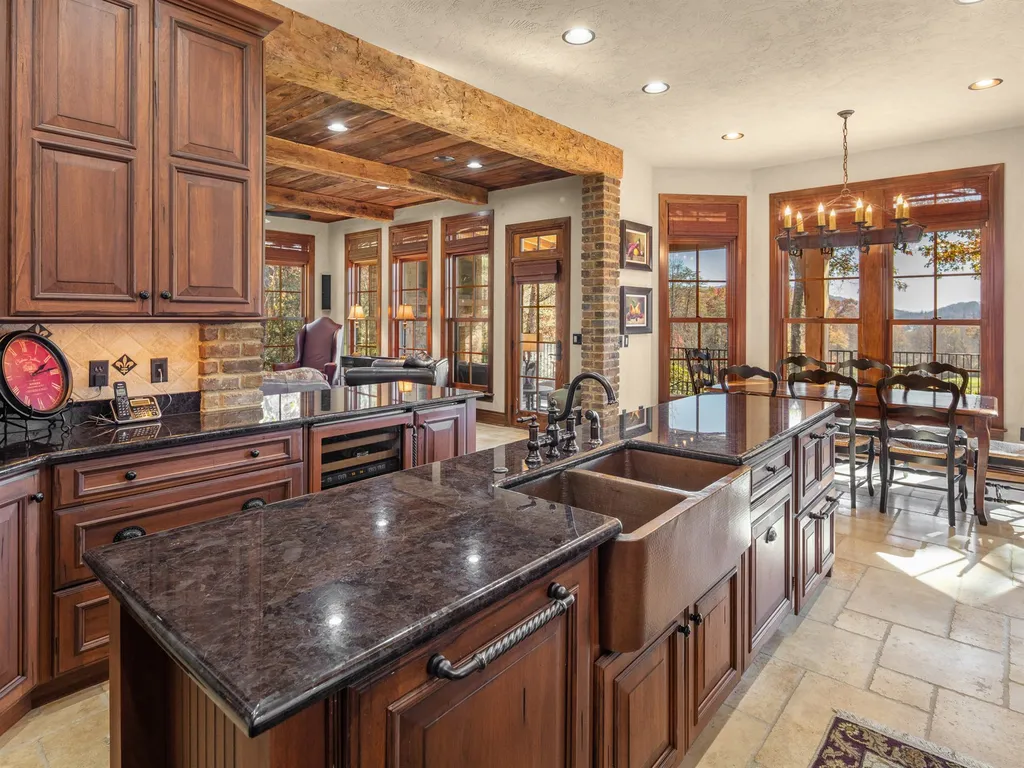 1987 White Tree Trail Home in Arden, North Carolina. Step into luxury living at this exceptional estate home overlooking the signature golf hole at The Cliffs of Walnut Cove. With old-world charm, meticulous details, and stunning mountain views, this residence offers a perfect blend of elegance and golf course living. Indulge in a gourmet kitchen, unique dining experiences, and a serene primary suite.