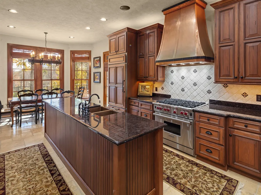 1987 White Tree Trail Home in Arden, North Carolina. Step into luxury living at this exceptional estate home overlooking the signature golf hole at The Cliffs of Walnut Cove. With old-world charm, meticulous details, and stunning mountain views, this residence offers a perfect blend of elegance and golf course living. Indulge in a gourmet kitchen, unique dining experiences, and a serene primary suite.