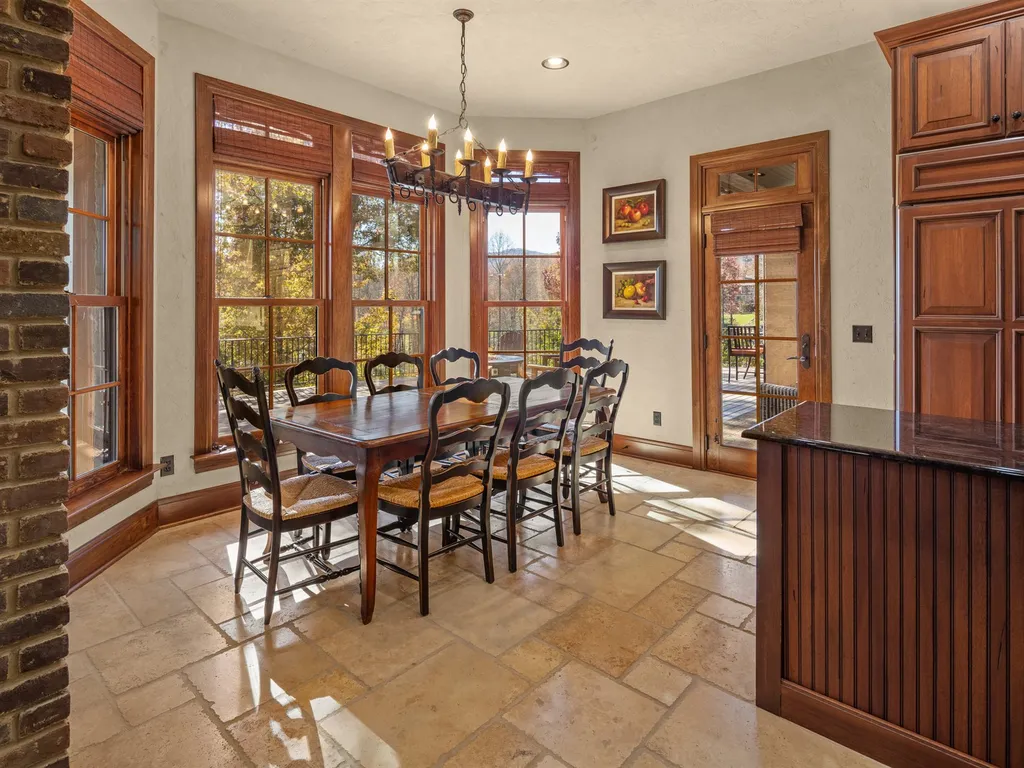 1987 White Tree Trail Home in Arden, North Carolina. Step into luxury living at this exceptional estate home overlooking the signature golf hole at The Cliffs of Walnut Cove. With old-world charm, meticulous details, and stunning mountain views, this residence offers a perfect blend of elegance and golf course living. Indulge in a gourmet kitchen, unique dining experiences, and a serene primary suite.