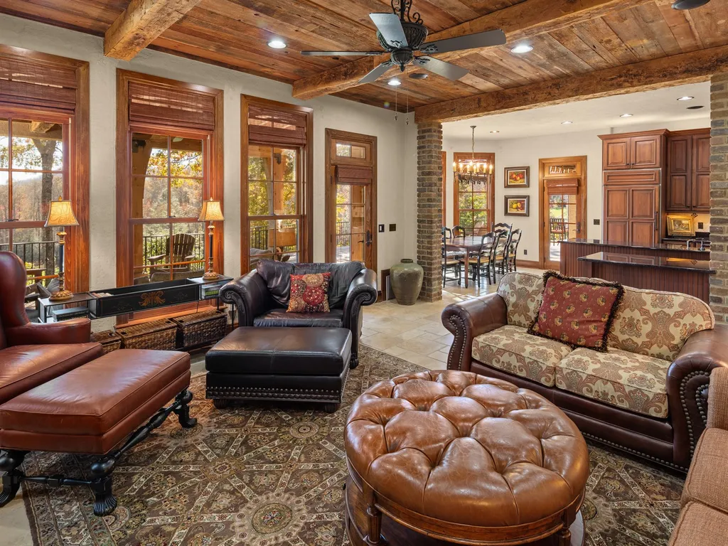 1987 White Tree Trail Home in Arden, North Carolina. Step into luxury living at this exceptional estate home overlooking the signature golf hole at The Cliffs of Walnut Cove. With old-world charm, meticulous details, and stunning mountain views, this residence offers a perfect blend of elegance and golf course living. Indulge in a gourmet kitchen, unique dining experiences, and a serene primary suite.