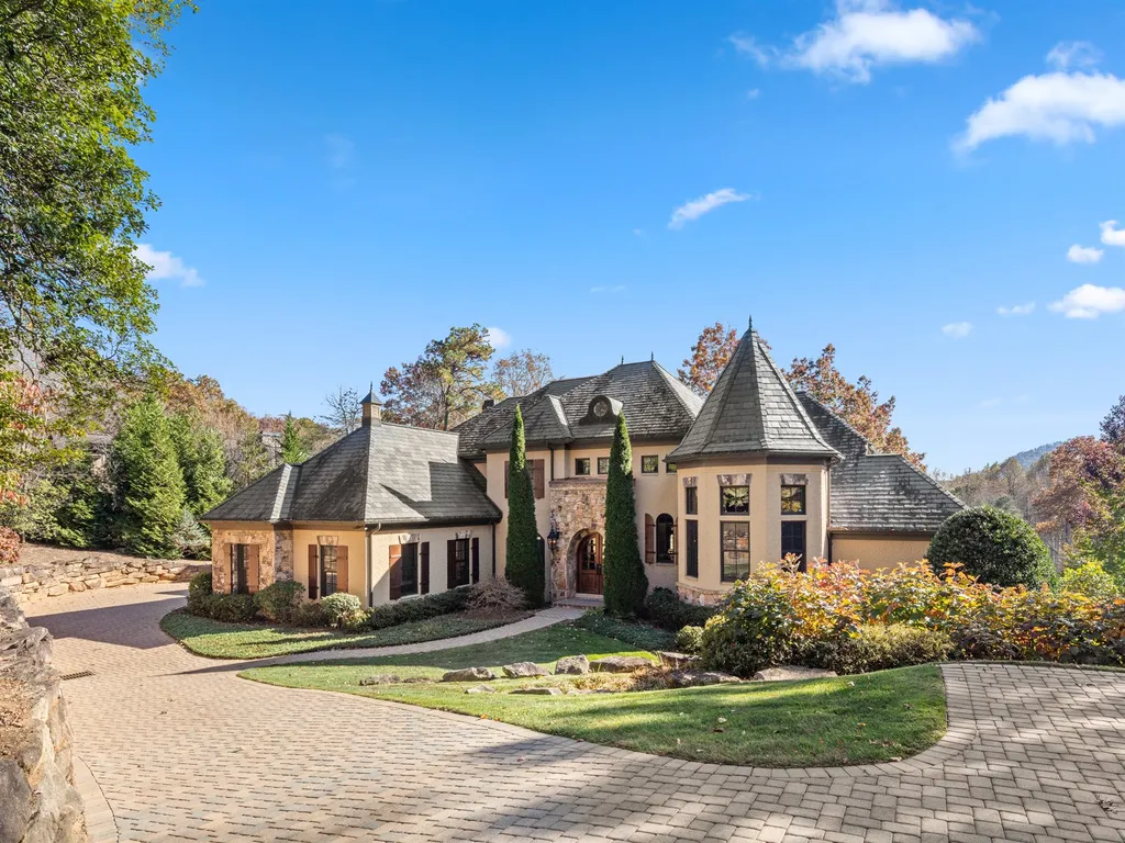 1987 White Tree Trail Home in Arden, North Carolina. Step into luxury living at this exceptional estate home overlooking the signature golf hole at The Cliffs of Walnut Cove. With old-world charm, meticulous details, and stunning mountain views, this residence offers a perfect blend of elegance and golf course living. Indulge in a gourmet kitchen, unique dining experiences, and a serene primary suite.