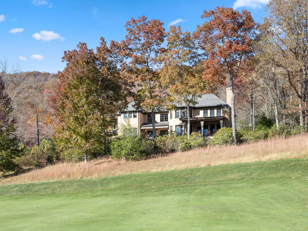 1987 White Tree Trail Home in Arden, North Carolina. Step into luxury living at this exceptional estate home overlooking the signature golf hole at The Cliffs of Walnut Cove. With old-world charm, meticulous details, and stunning mountain views, this residence offers a perfect blend of elegance and golf course living. Indulge in a gourmet kitchen, unique dining experiences, and a serene primary suite.